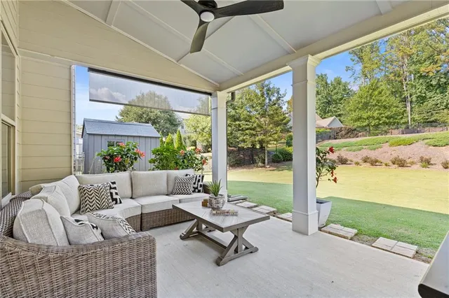 an aerial view of a house with a yard basket ball court and outdoor seating