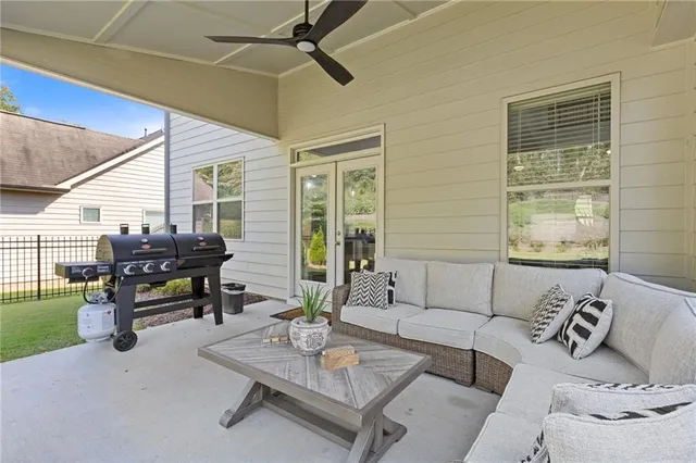a aerial view of a house with swimming pool and sitting area