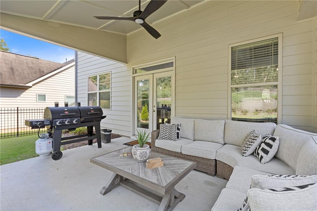 4867 Hunters Grove Way Sugar Hill, GA 30518 - Photo 50 of 61 a living room with furniture and a window