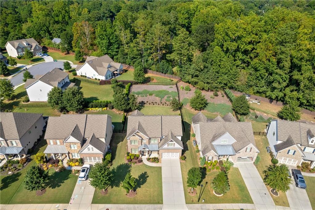 4867 Hunters Grove Way Sugar Hill, GA 30518 - Photo 57 of 61 an aerial view of residential house with outdoor space