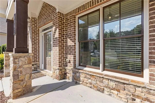 a front view of a house with large windows