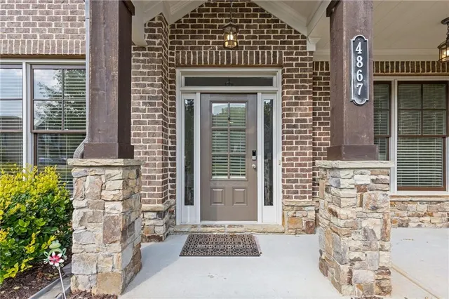 a view of entryway with furniture and wooden floor