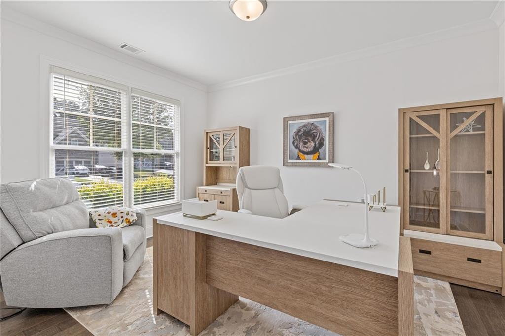 4867 Hunters Grove Way Sugar Hill, GA 30518 - Photo 10 of 61 a living room with furniture windows and a dining table