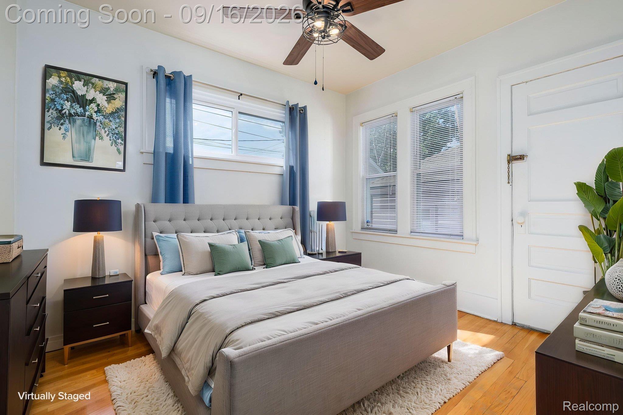 999 Nottingham Road Grosse Pointe, MI 48230 - Photo 22 of 30 Wood-finish flooring with white trim and a ceiling fan