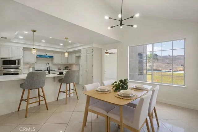 a white bath tub sitting in a bathroom next to a window