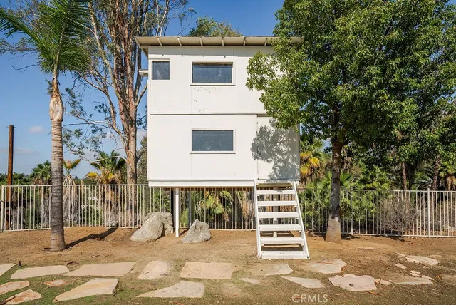 an aerial view of residential house with outdoor space