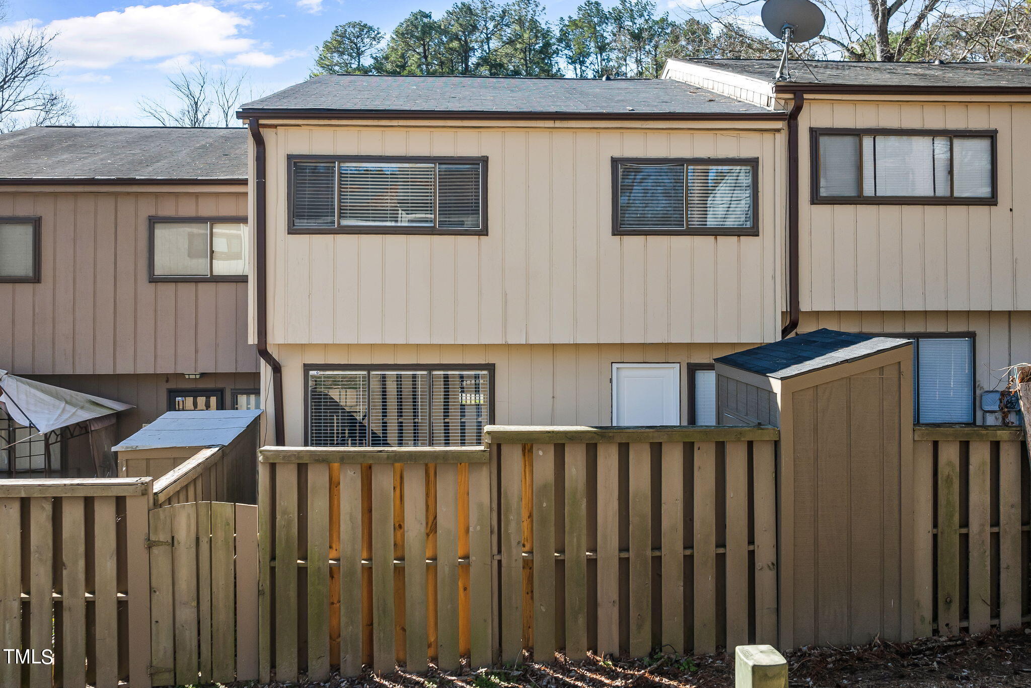 721 East Millbrook Road Raleigh, NC 27609 - Photo 27 of 28 a view of a house with wooden fence