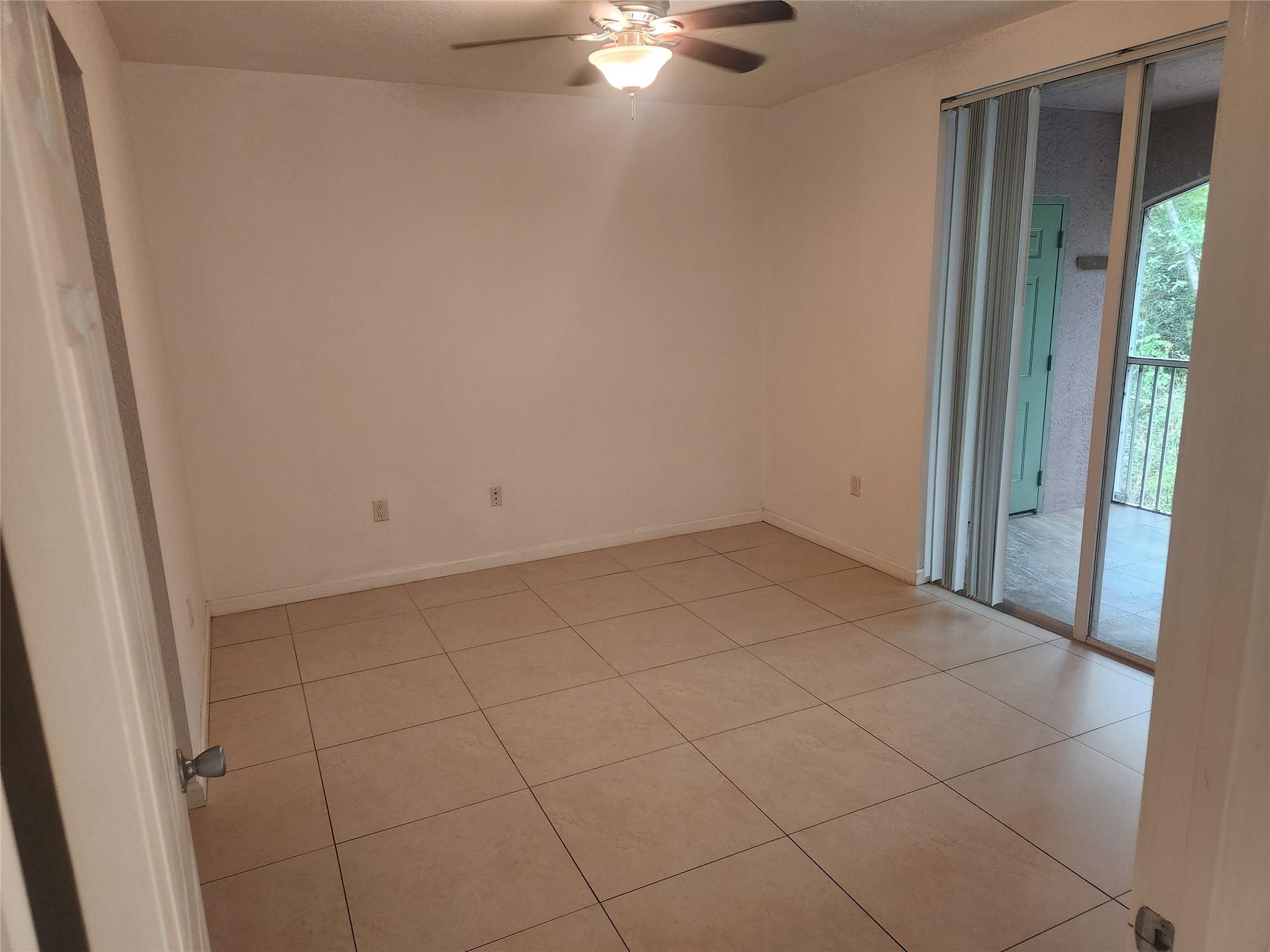 6778 West Sample Road, Unit 6778 Pompano Beach, FL 33067 - Photo 14 of 20 a view of a room with an empty space and a window