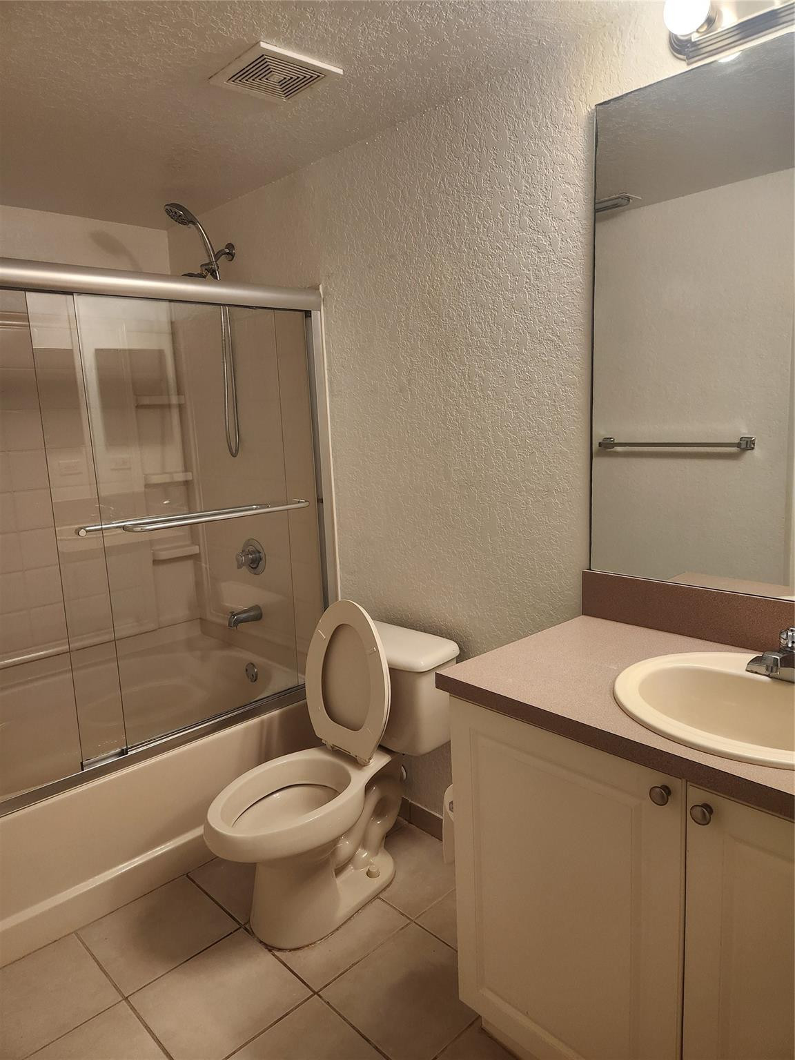 6778 West Sample Road, Unit 6778 Pompano Beach, FL 33067 - Photo 17 of 20 a bathroom with a sink a toilet and shower