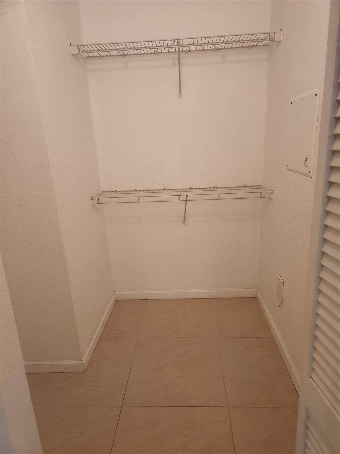 6778 West Sample Road, Unit 6778 Pompano Beach, FL 33067 - Photo 20 of 20 a view of a room with racks on the wall