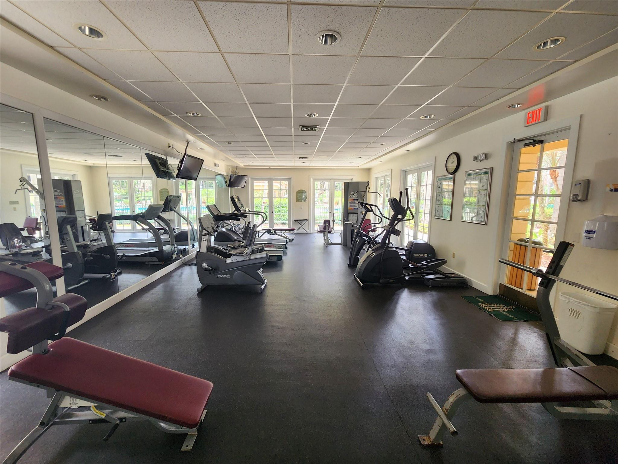 6778 West Sample Road, Unit 6778 Pompano Beach, FL 33067 - Photo 6 of 20 a view of a room with gym equipment