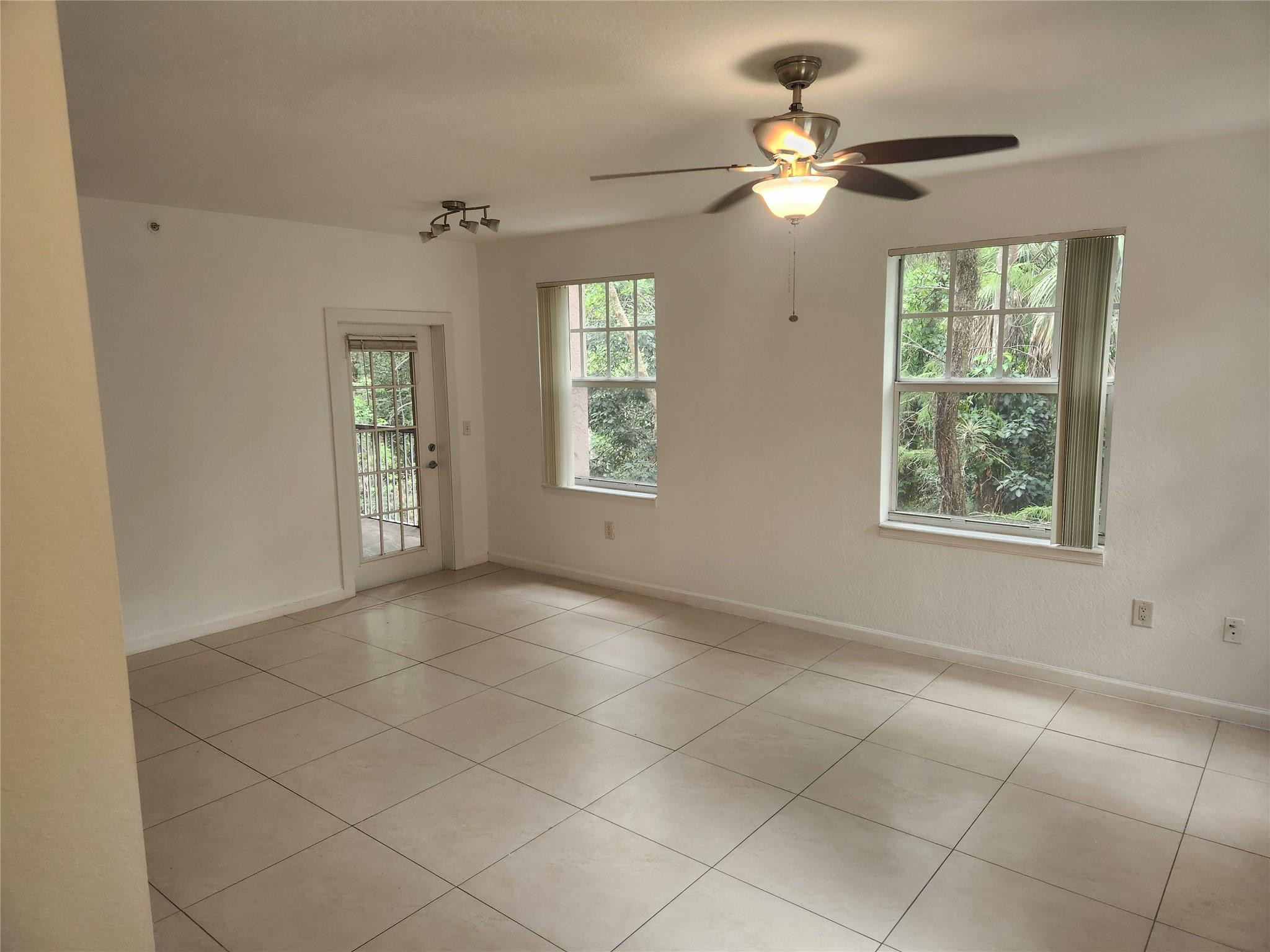 6778 West Sample Road, Unit 6778 Pompano Beach, FL 33067 - Photo 10 of 20 a view of an empty room with a window