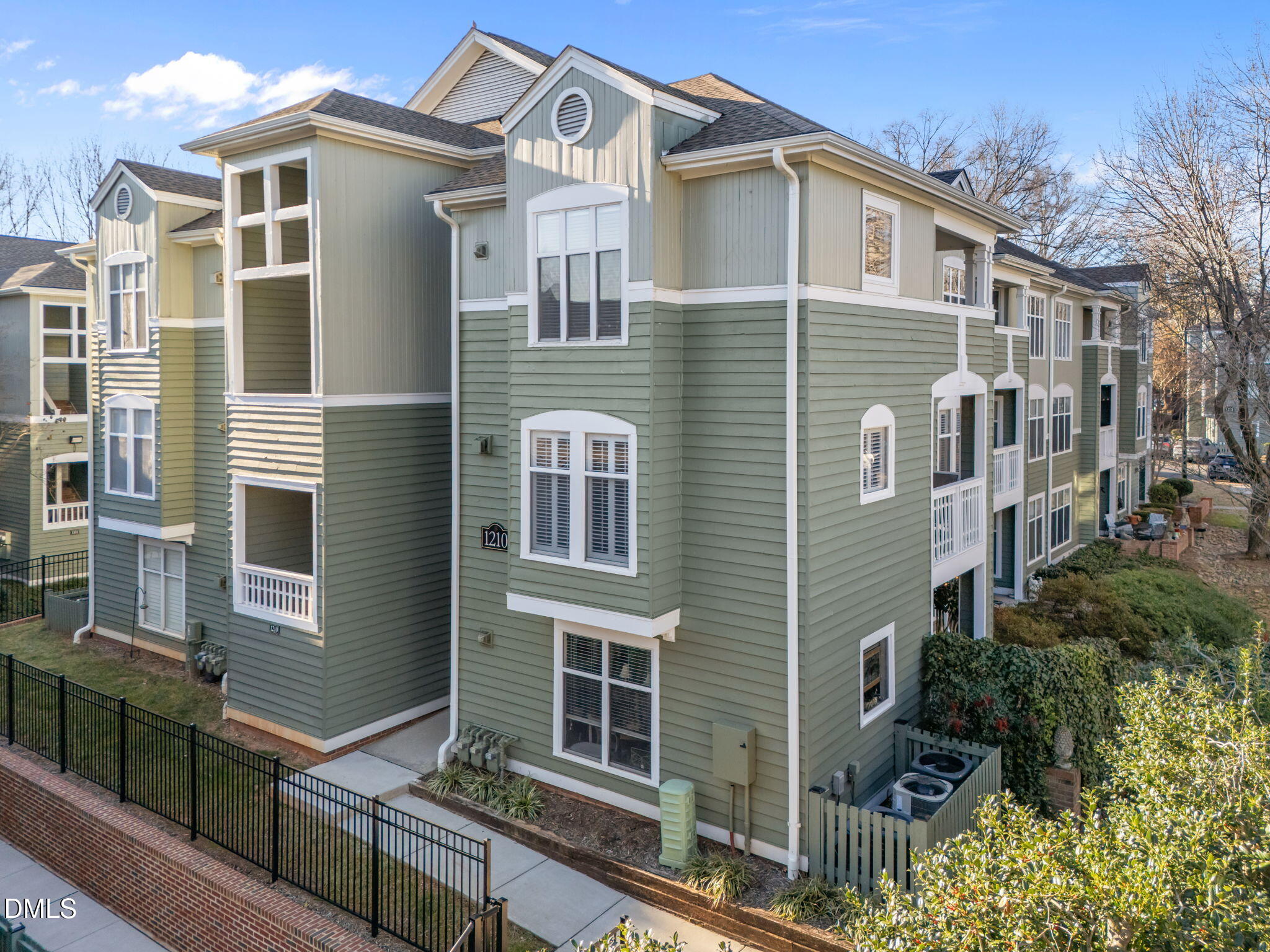 1210 Westview Lane, Unit 309 Raleigh, NC 27605 - Photo 13 of 42 a front view of a house with a yard