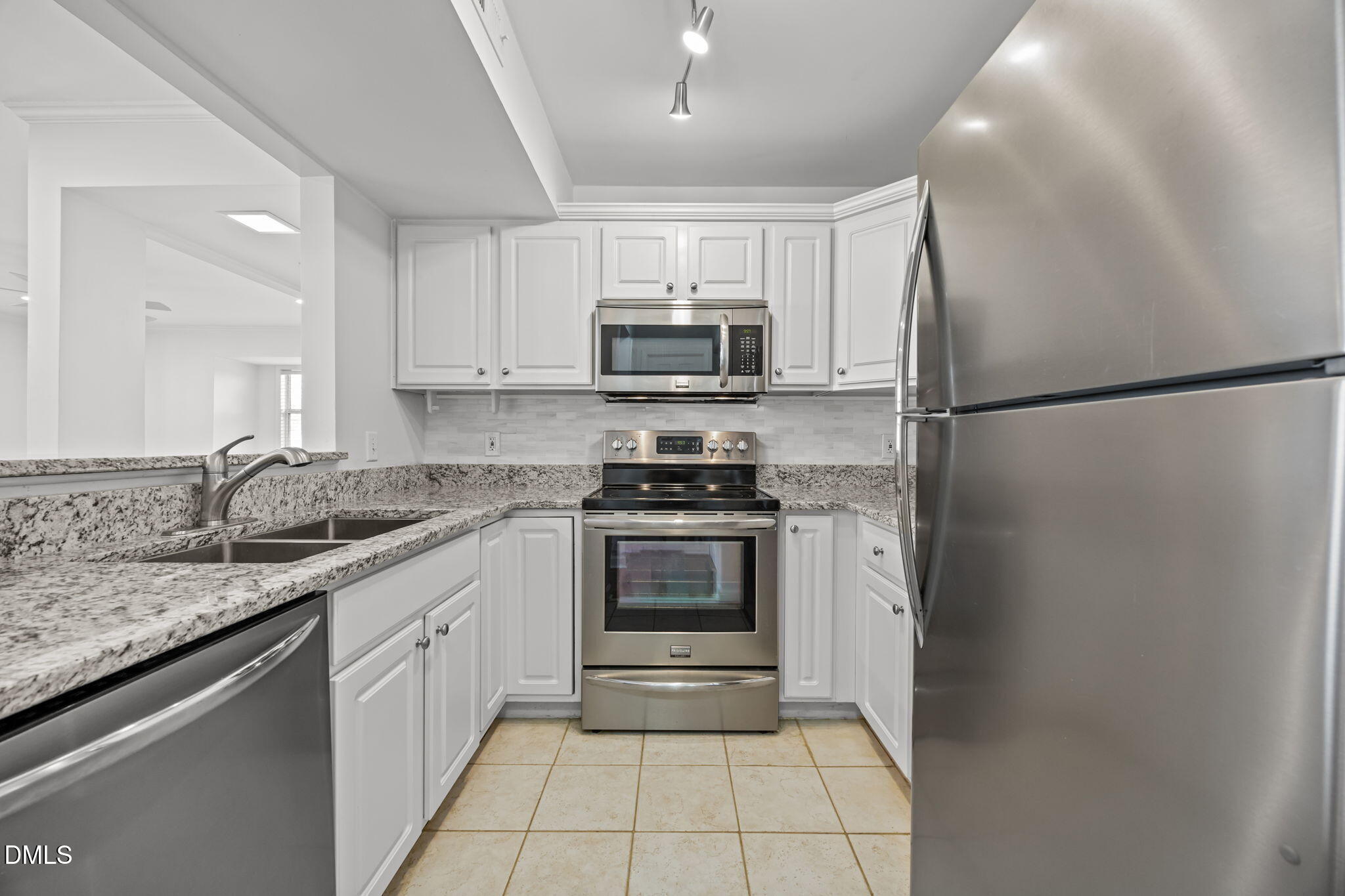 1210 Westview Lane, Unit 309 Raleigh, NC 27605 - Photo 14 of 42 a kitchen with a refrigerator and a sink