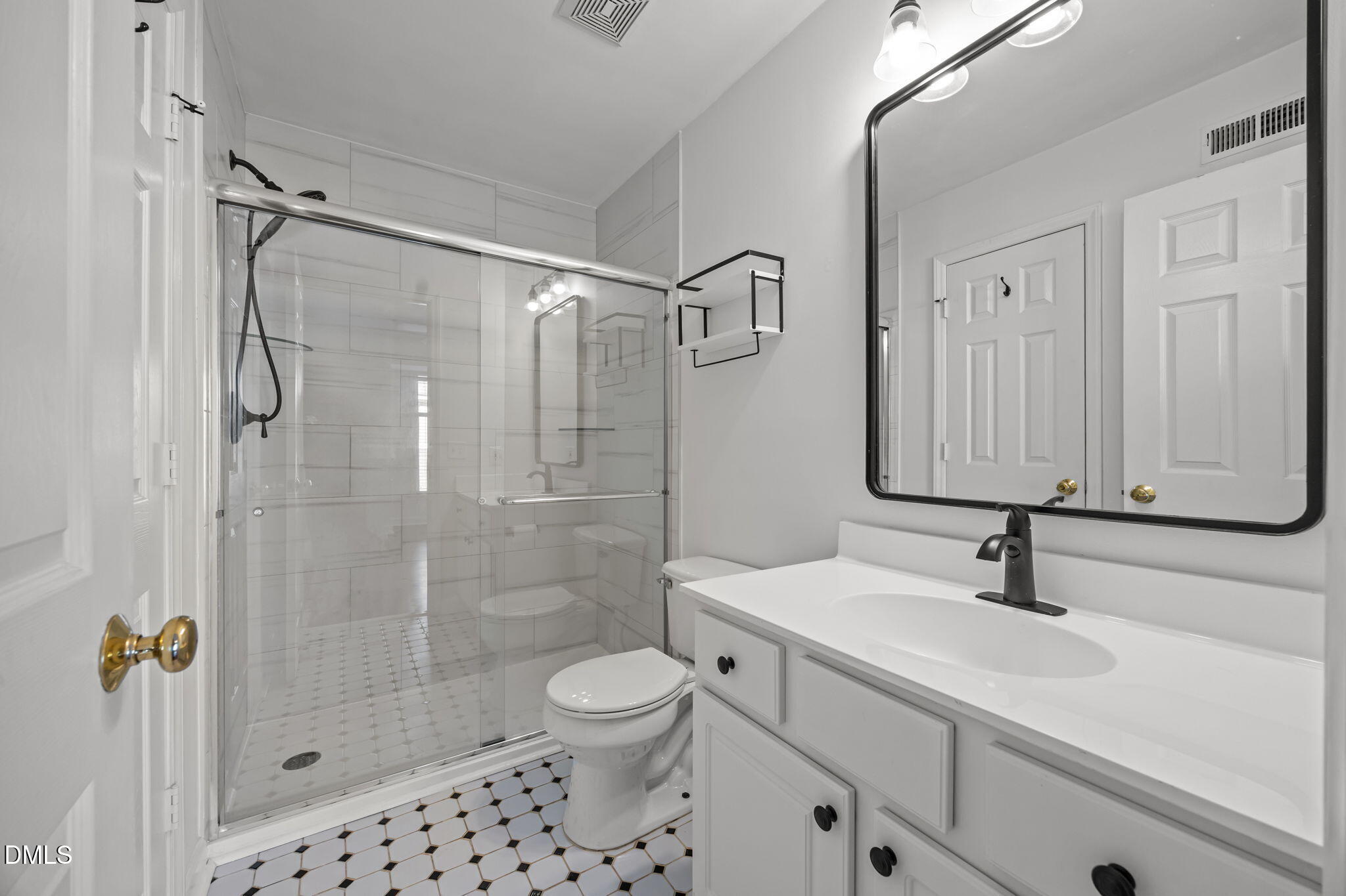 1210 Westview Lane, Unit 309 Raleigh, NC 27605 - Photo 20 of 42 a bathroom with a sink a toilet and shower