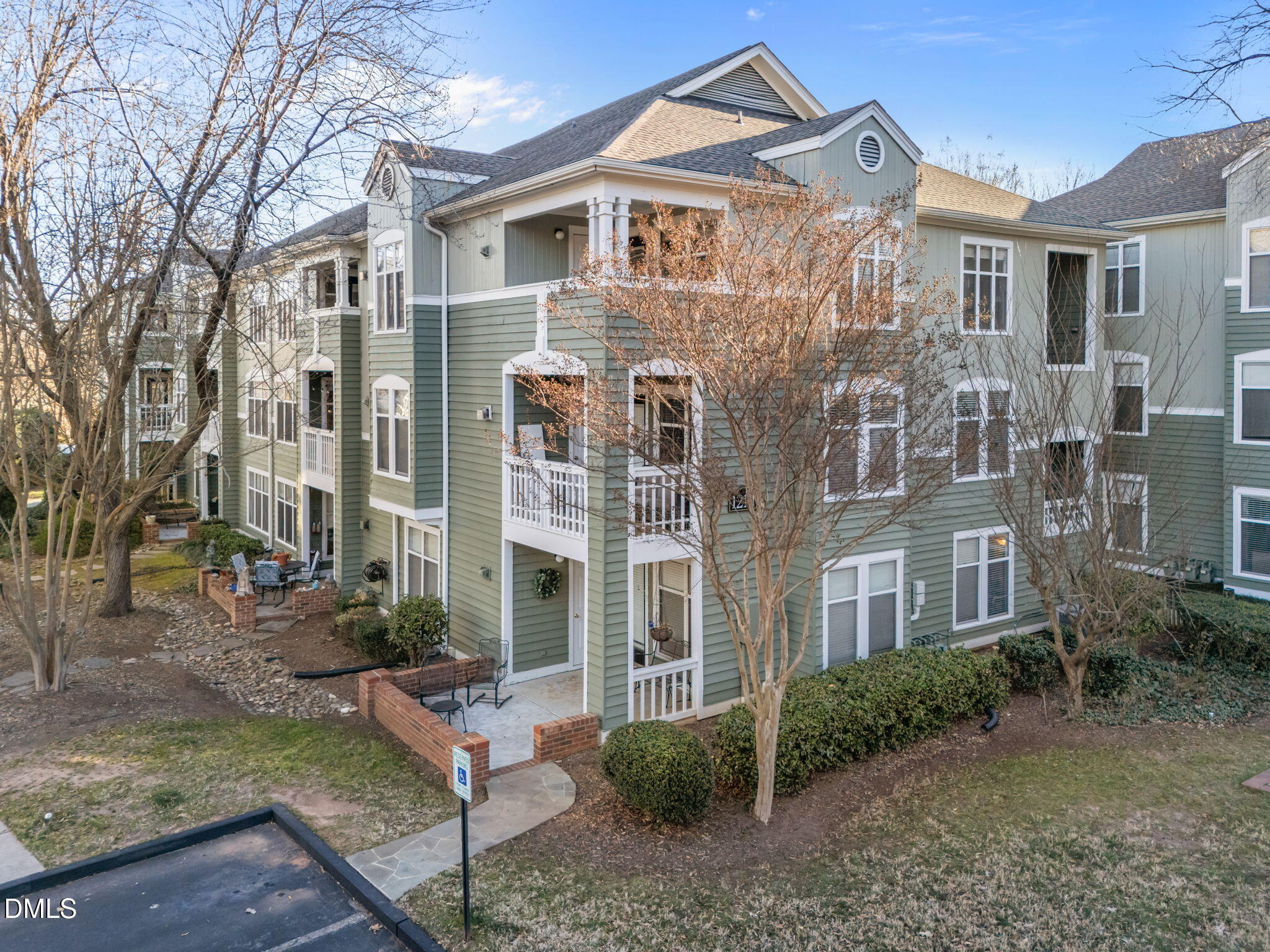 1210 Westview Lane, Unit 309 Raleigh, NC 27605 - Photo 24 of 42 a view of a brick building next to a yard