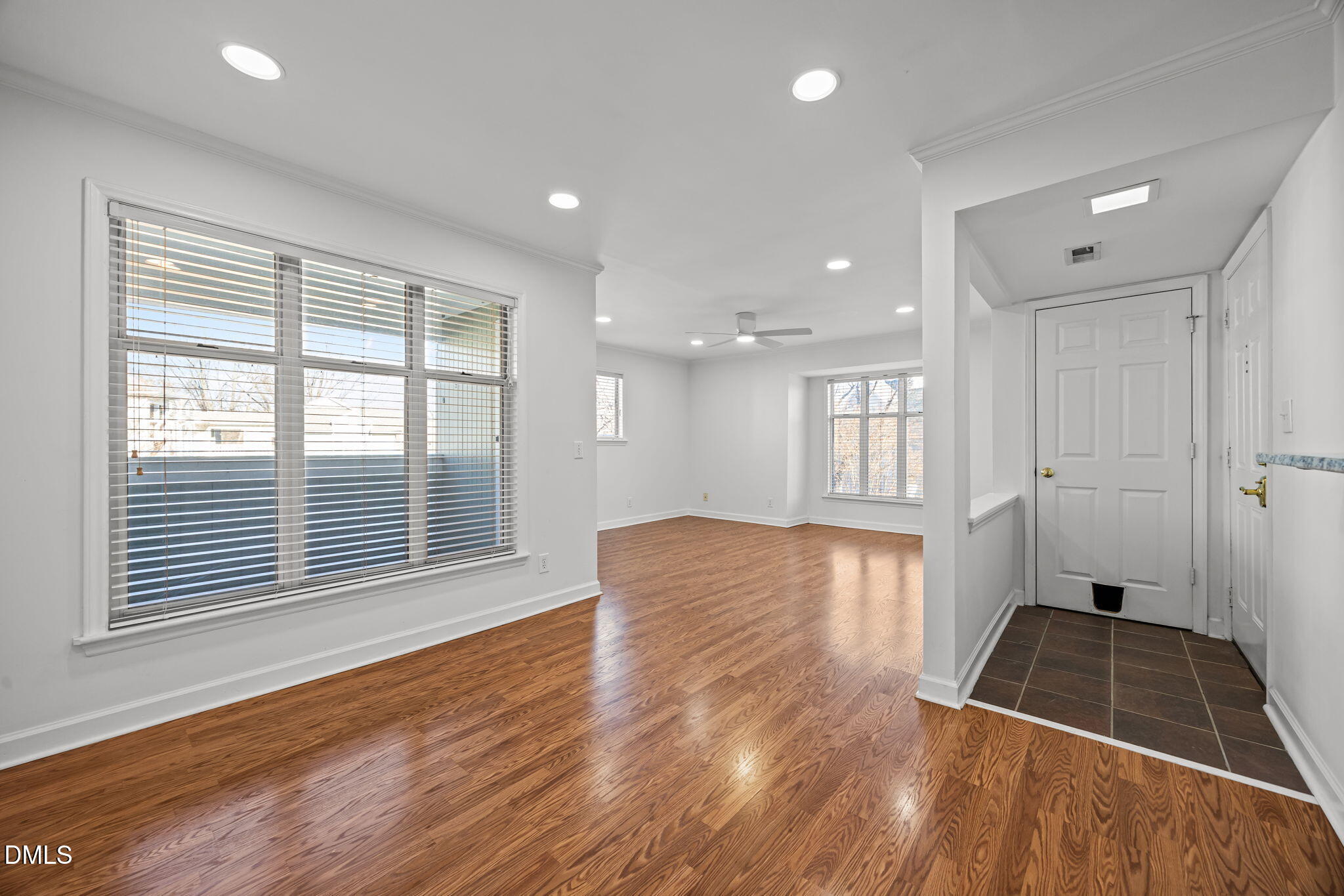 1210 Westview Lane, Unit 309 Raleigh, NC 27605 - Photo 7 of 42 a view of an empty room with wooden floor and a window