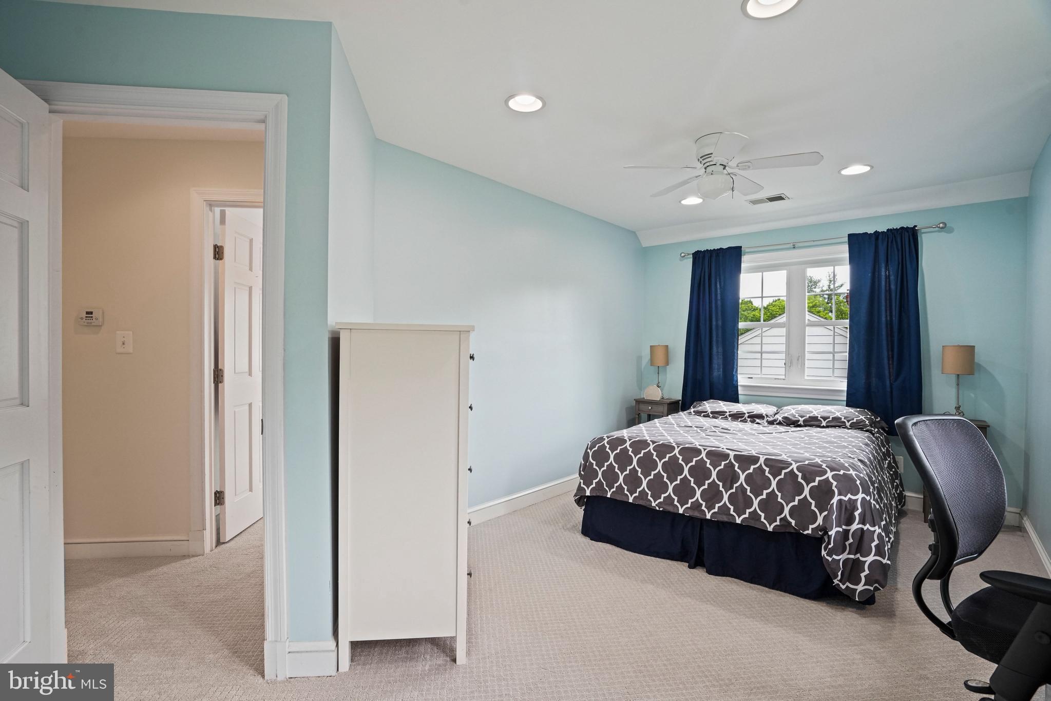 1907 Brisbane Street Silver Spring, MD 20902 - Photo 28 of 39 a bedroom with a bed and a window