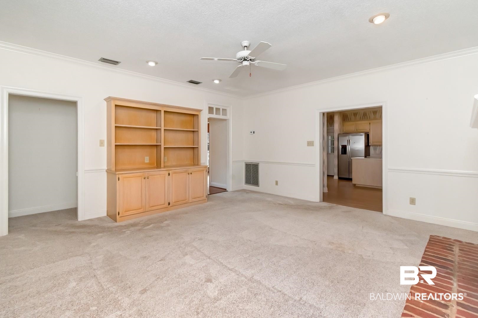 105 McHugh Lane Mobile, AL 36608 - Photo 9 of 30 Unfurnished living room with light carpet, ceiling fan, crown molding, and recessed lighting