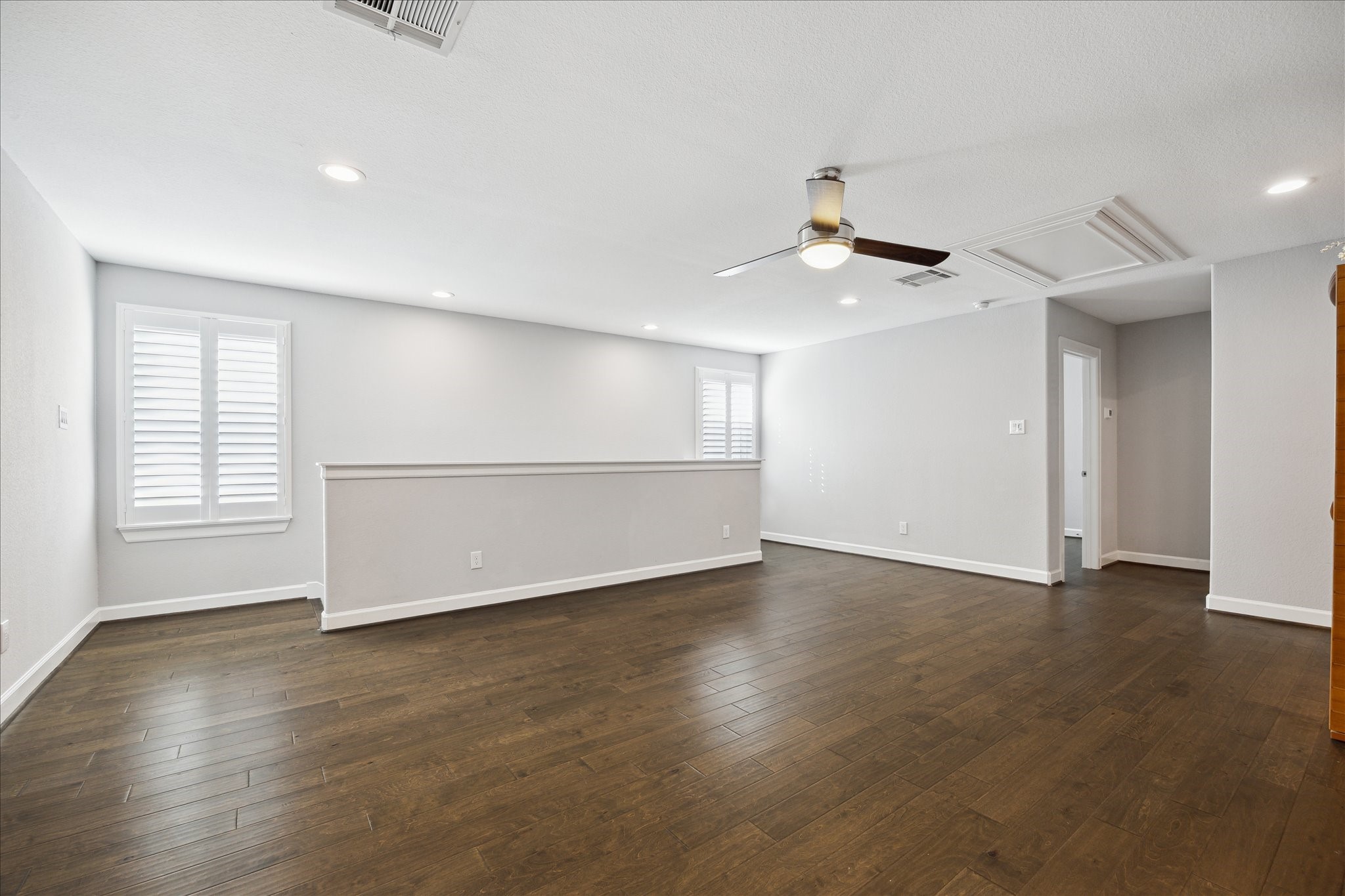 2430 Sheridan Street Houston, TX 77030 - Photo 22 of 28 a view of an empty room with wooden floor and a window