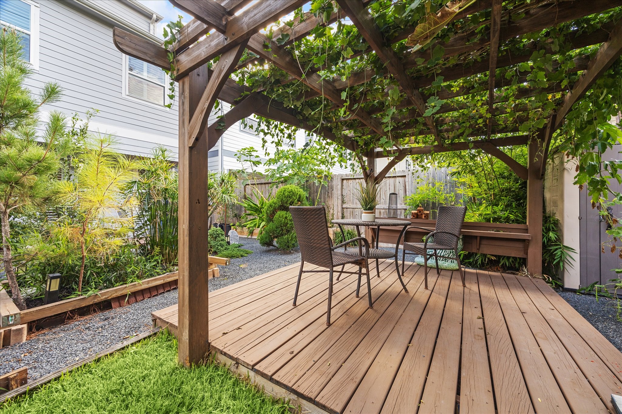 2430 Sheridan Street Houston, TX 77030 - Photo 27 of 28 a view of a chairs and table on the wooden deck