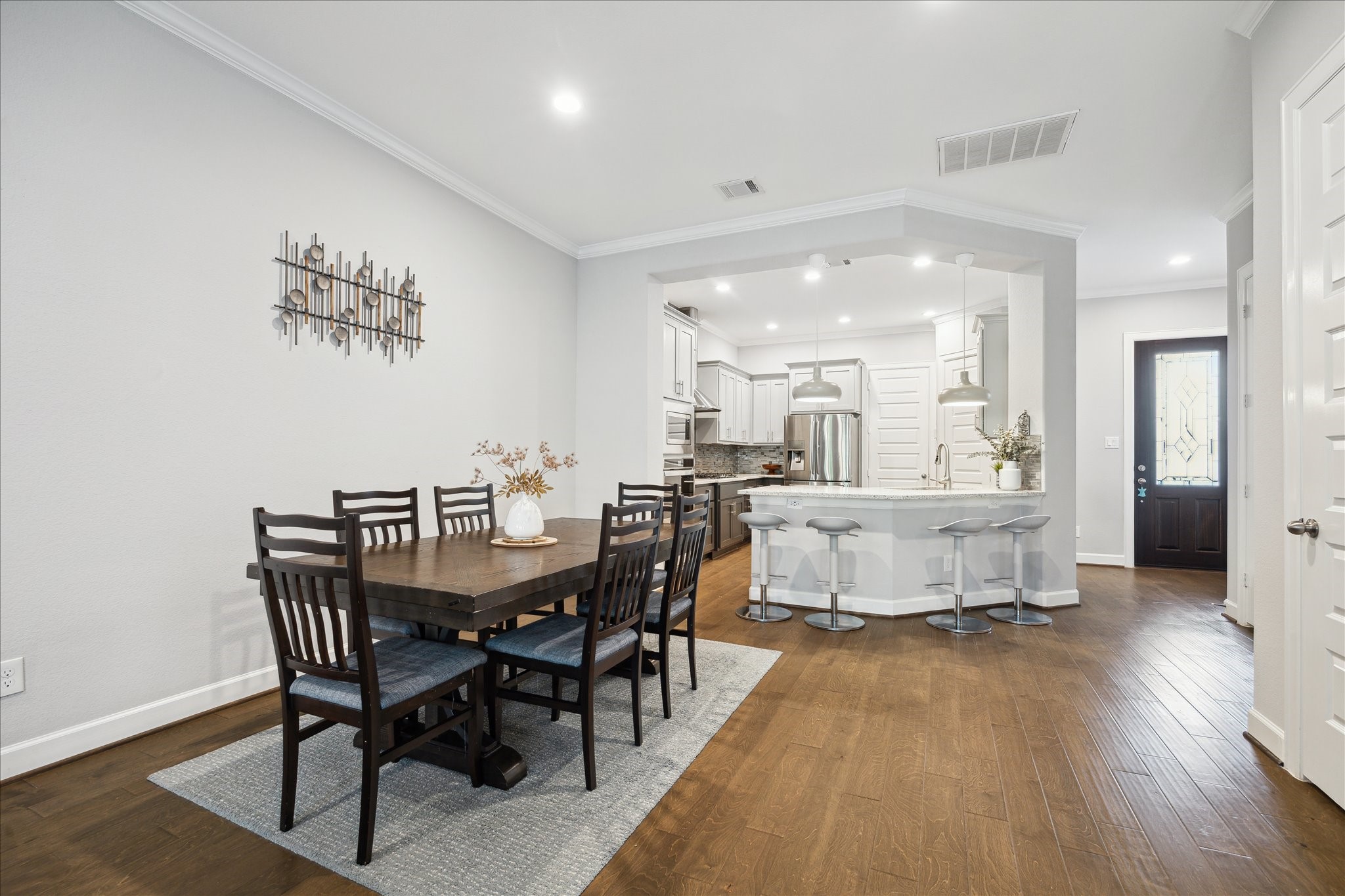 2430 Sheridan Street Houston, TX 77030 - Photo 4 of 28 a view of a dining room with furniture and wooden floor