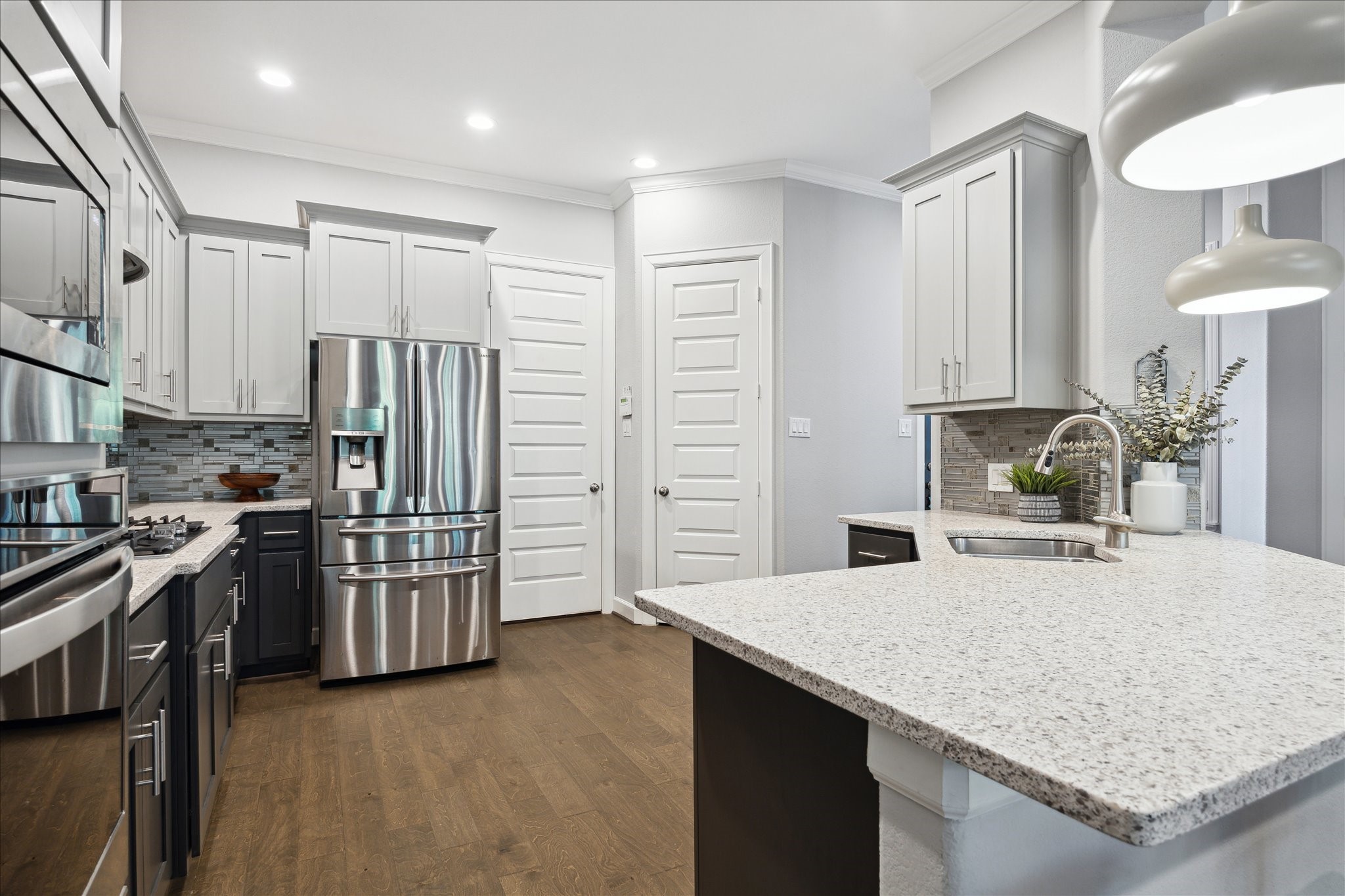 2430 Sheridan Street Houston, TX 77030 - Photo 9 of 28 a kitchen with stainless steel appliances granite countertop a sink refrigerator and microwave