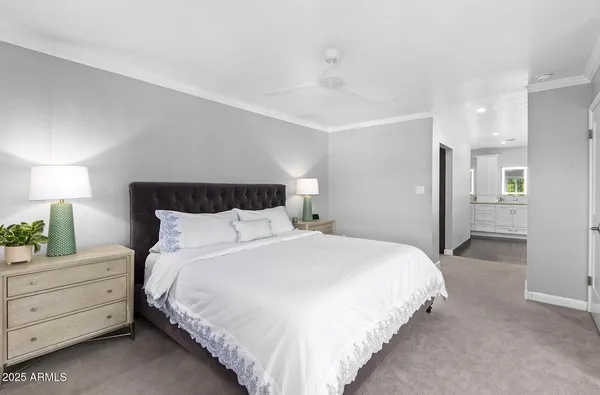 a bedroom with bed and a window