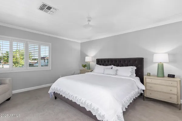 a bedroom with a balcony a bed and a couch