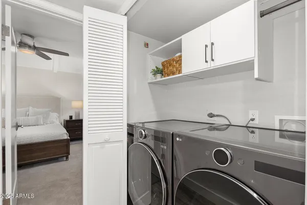 a bathroom with a granite countertop sink a toilet and a mirror