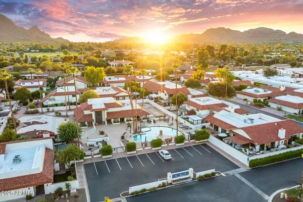 an aerial view of residential houses with outdoor space