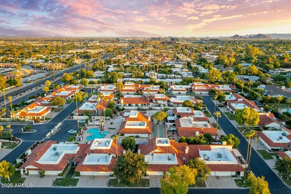 an aerial view of residential houses with outdoor space