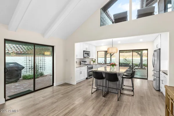 a kitchen with stainless steel appliances granite countertop counter space a sink cabinets and stainless steel appliances