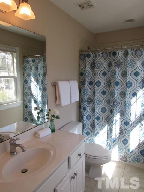 537 Pace Street Raleigh, NC 27604 - Photo 21 of 25 a bathroom with a sink toilet and shower