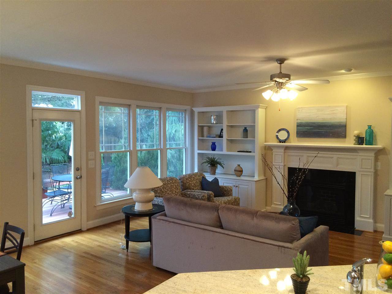 537 Pace Street Raleigh, NC 27604 - Photo 8 of 25 a living room with furniture and a fireplace