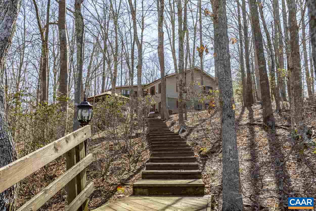 73 Amethyst Road Palmyra, VA 22963 - Photo 11 of 56 a view of a large building with large trees and stairs