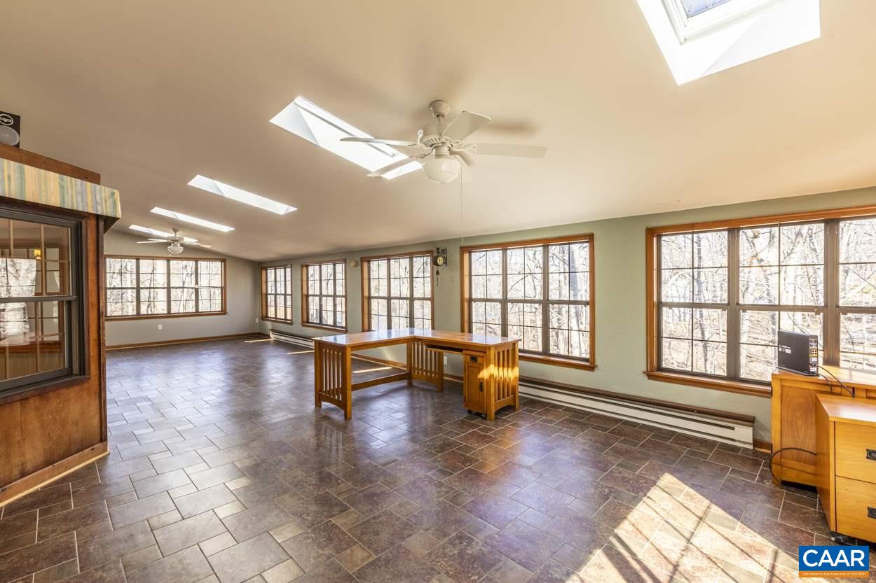 73 Amethyst Road Palmyra, VA 22963 - Photo 25 of 56 a living room with furniture and large windows