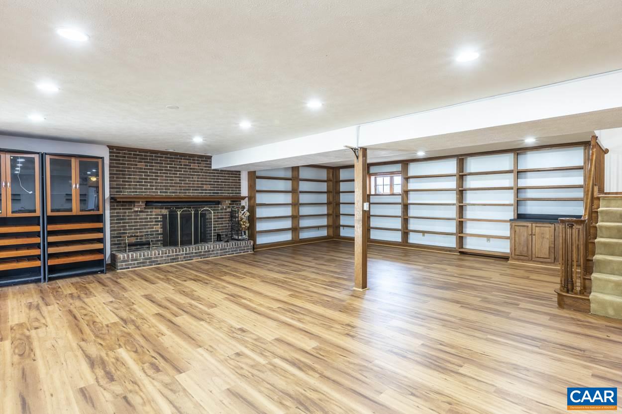 73 Amethyst Road Palmyra, VA 22963 - Photo 38 of 56 wooden floor in an empty room with a fireplace