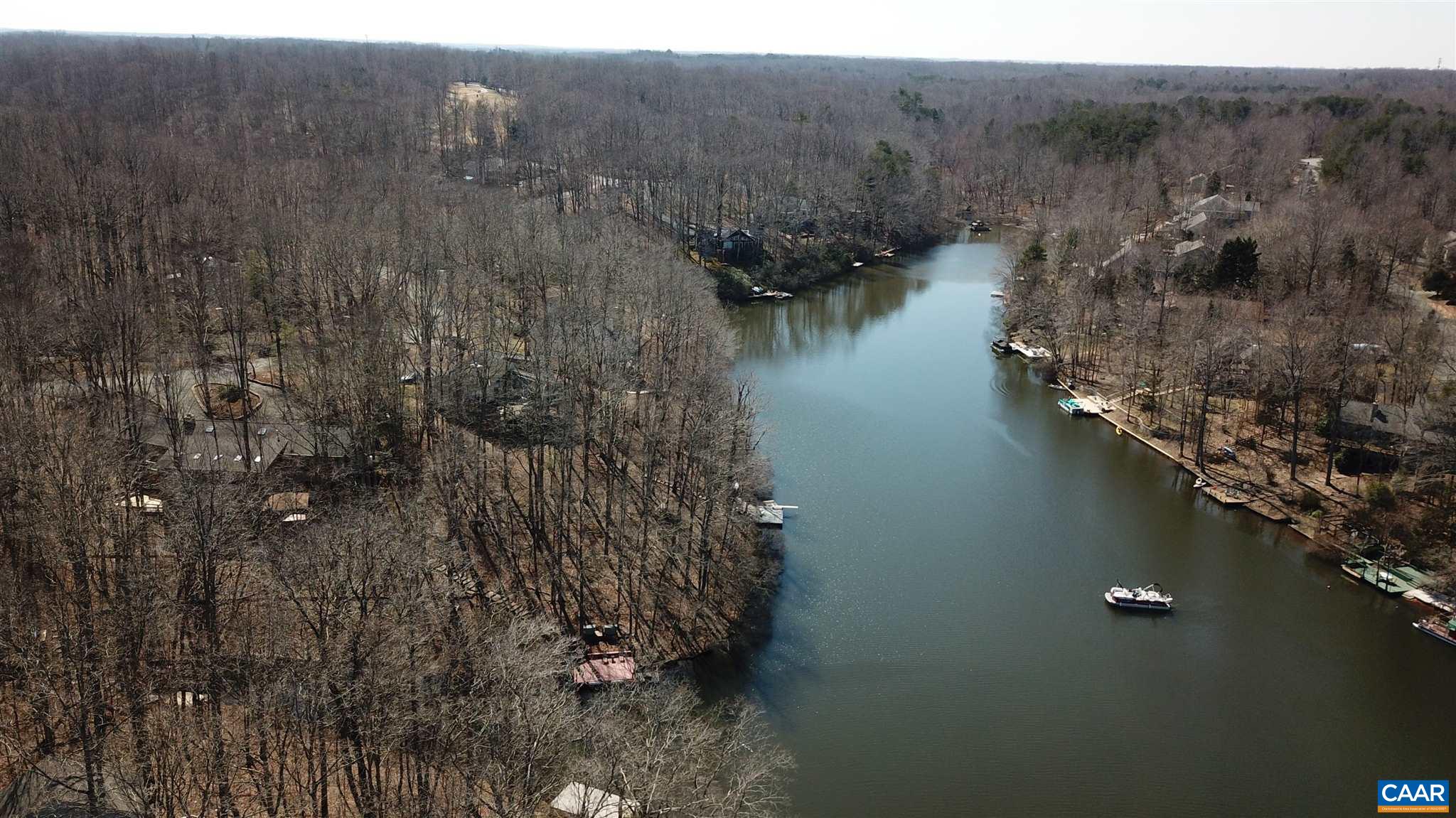 73 Amethyst Road Palmyra, VA 22963 - Photo 54 of 56 a view of a lake in middle of forest