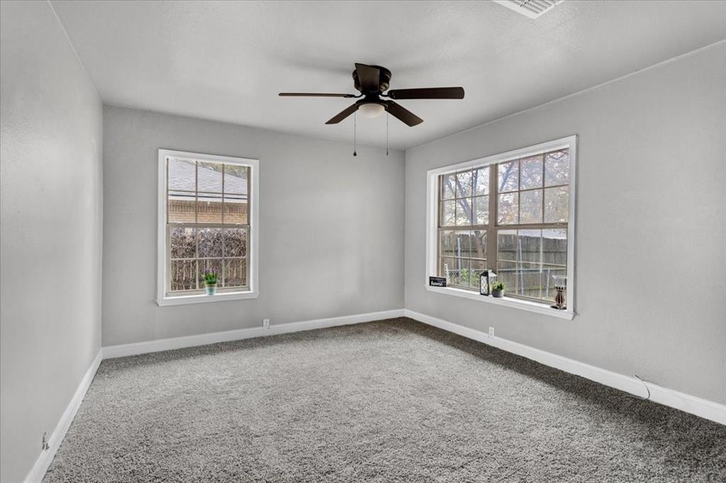 736 Bullock Street Denison, TX 75020 - Photo 13 of 21 a view of an empty room with a window