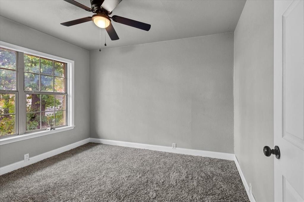 736 Bullock Street Denison, TX 75020 - Photo 15 of 21 a view of an empty room with a window