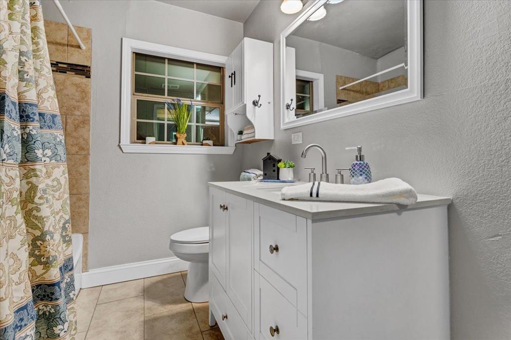736 Bullock Street Denison, TX 75020 - Photo 17 of 21 a bathroom with a sink and a toilet