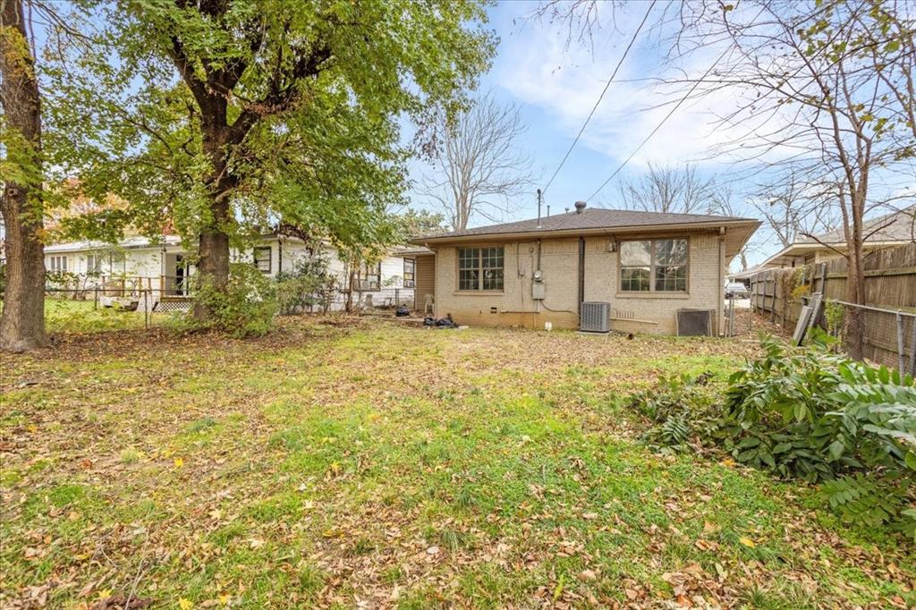 736 Bullock Street Denison, TX 75020 - Photo 20 of 21 a front view of a house with a garden