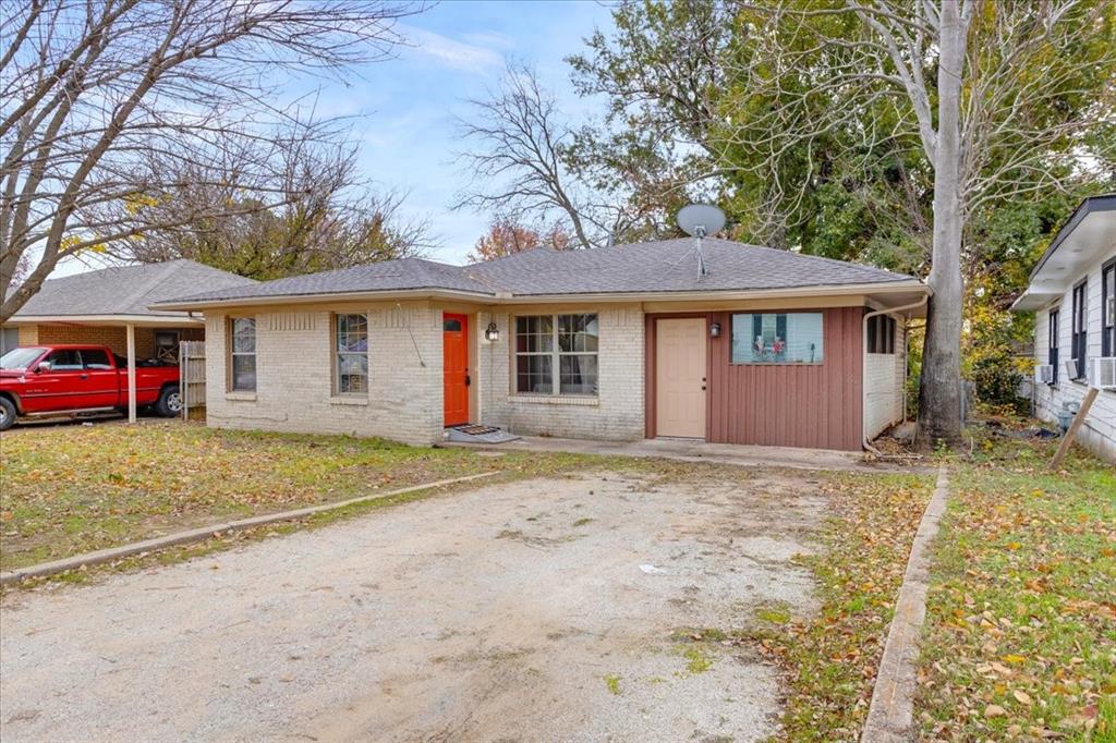 736 Bullock Street Denison, TX 75020 - Photo 2 of 21 a front view of a house with a yard and garage