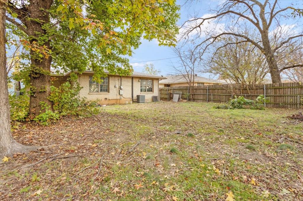 736 Bullock Street Denison, TX 75020 - Photo 21 of 21 a front view of a house with a yard