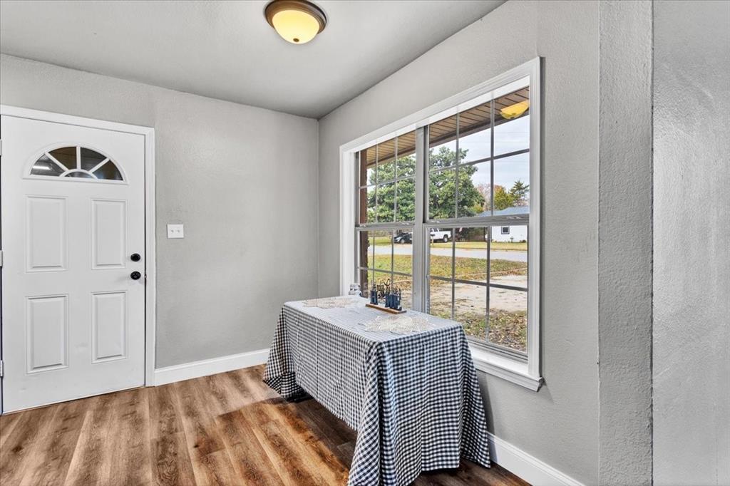 736 Bullock Street Denison, TX 75020 - Photo 9 of 21 a bedroom with a bed and a window