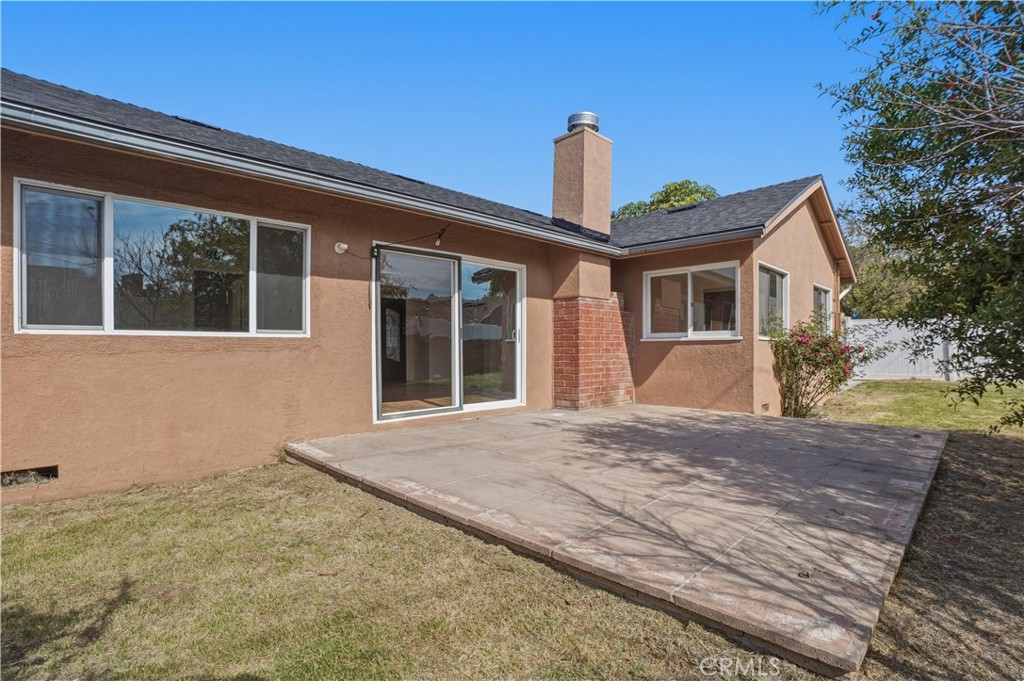 14808 Aztec Street Sylmar, CA 91342 - Photo 20 of 23 a front view of a house with a yard