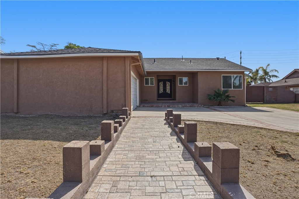 14808 Aztec Street Sylmar, CA 91342 - Photo 22 of 23 a front view of house with yard