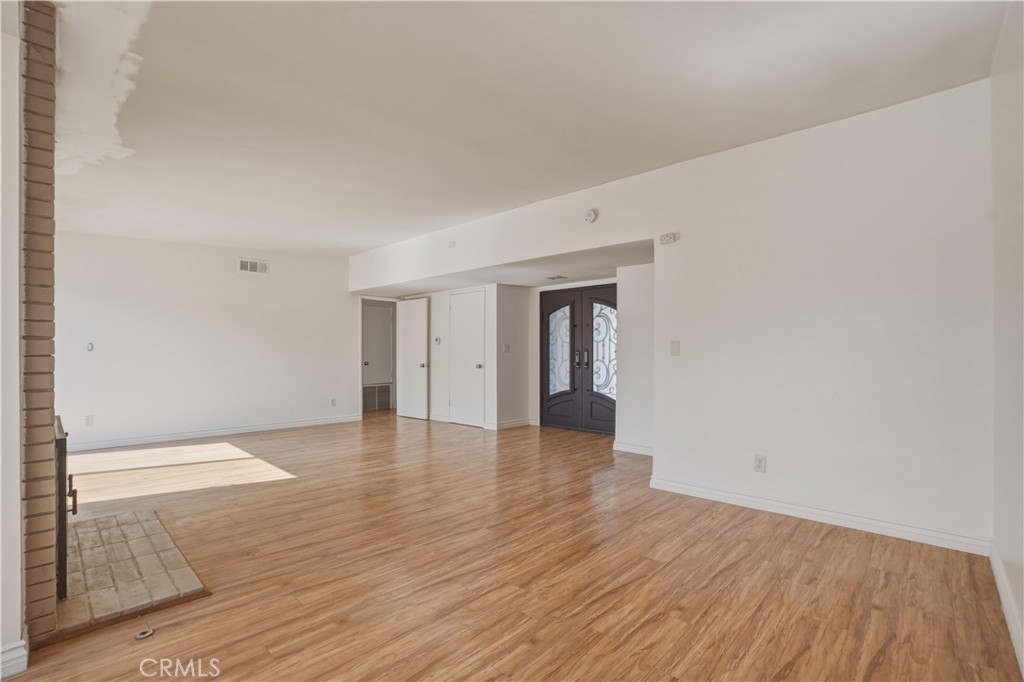 14808 Aztec Street Sylmar, CA 91342 - Photo 3 of 23 a view of an empty room and wooden floor