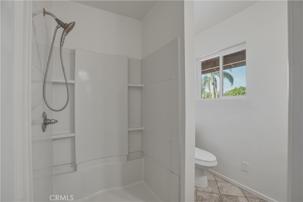 14808 Aztec Street Sylmar, CA 91342 - Photo 9 of 23 a bathroom with a shower and toilet